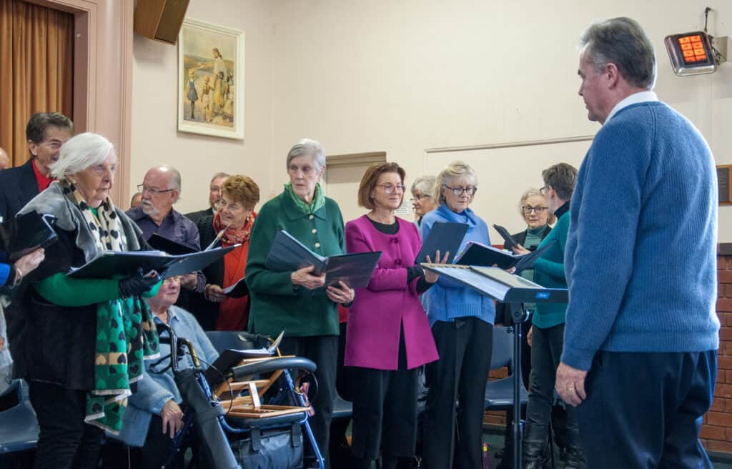 Musical Director speaking with choir – Allegri Singers – Oberon August 2025 image